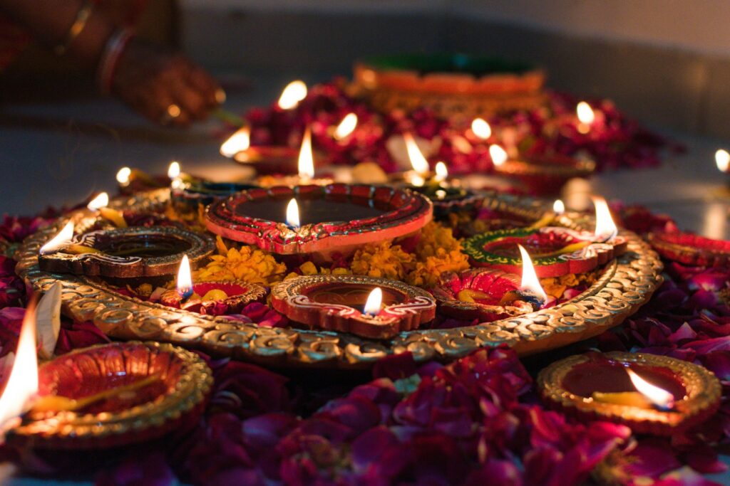 Diwali diyas representing savings and investment planning for a bonus